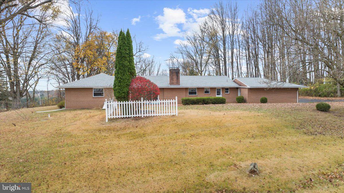 935 Ebelhare Road Pottstown, PA 19465 - Photo 5 of 52 a front view of a house with a yard and garage