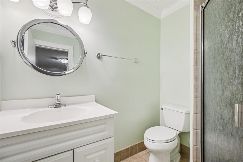 1500 Gay Road, Unit 21C Winter Park, FL 32789 - Photo 18 of 27 a bathroom with a sink a toilet and a mirror