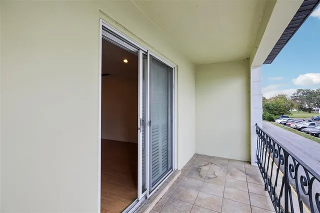 a view of washer and dryer with kitchen in the background
