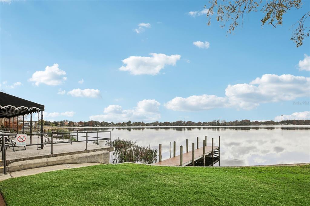 1500 Gay Road, Unit 21C Winter Park, FL 32789 - Photo 2 of 27 a view of a lake with houses in the back