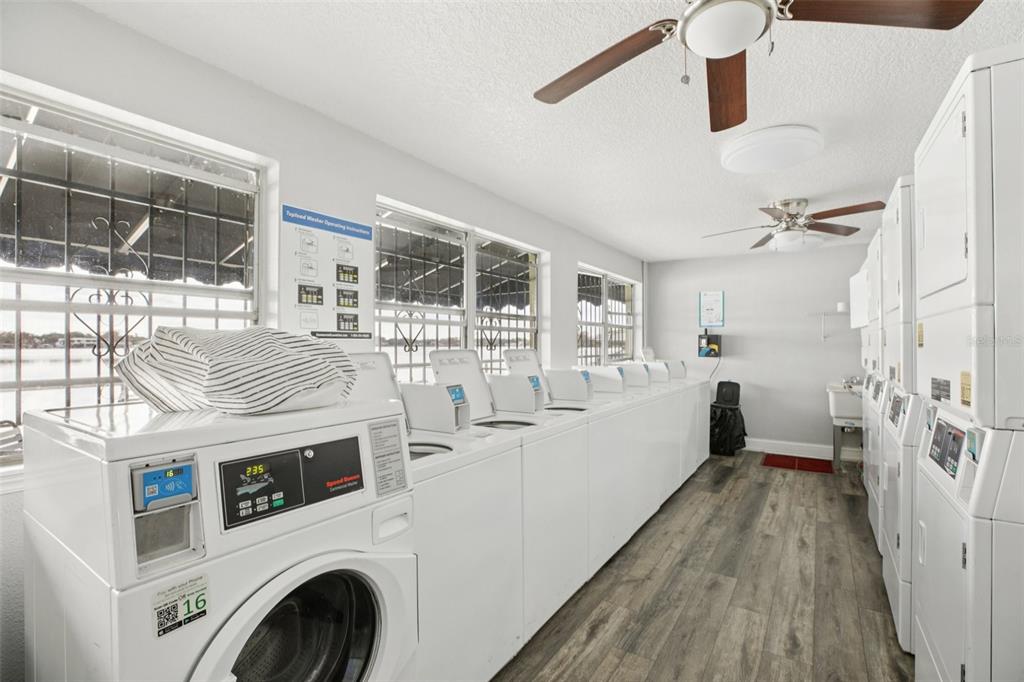 1500 Gay Road, Unit 21C Winter Park, FL 32789 - Photo 22 of 27 a view of washer and dryer with kitchen in the background