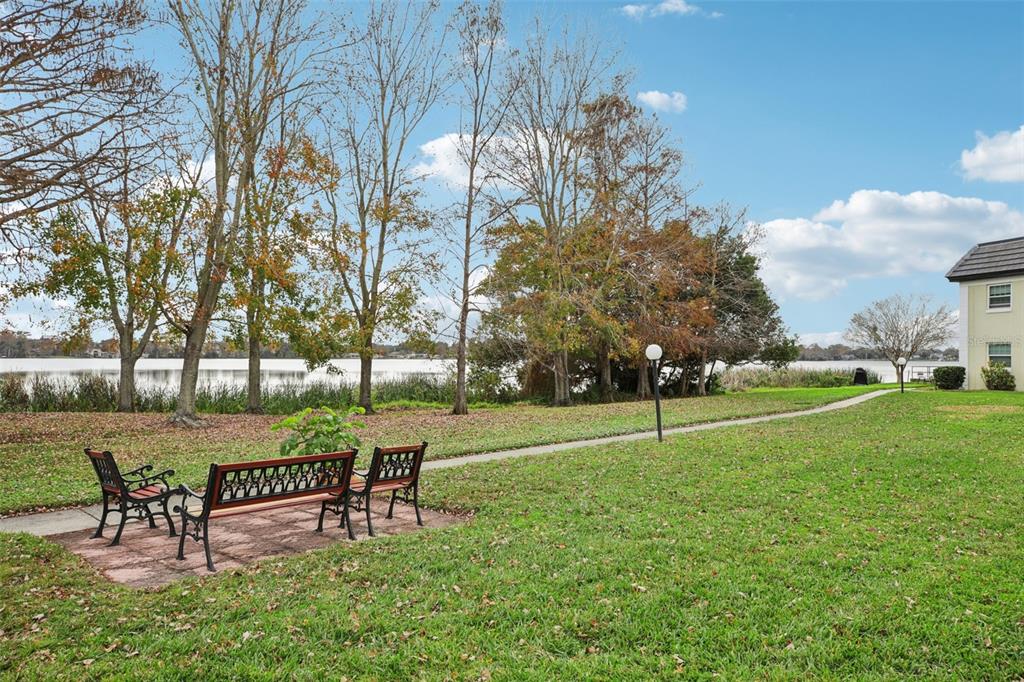 1500 Gay Road, Unit 21C Winter Park, FL 32789 - Photo 25 of 27 a view of a park with bench and trees