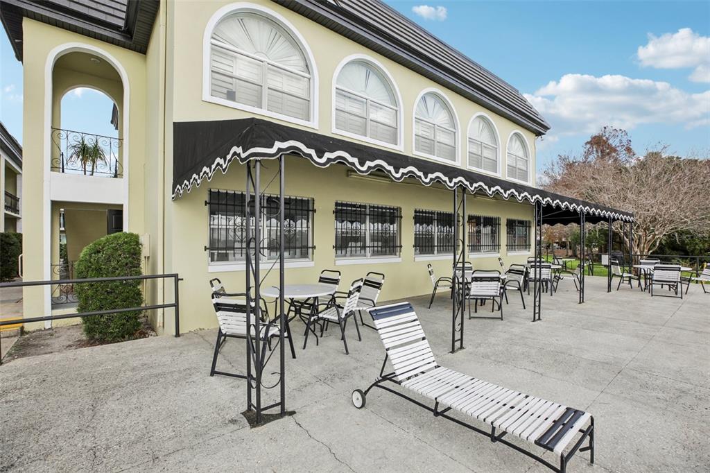 1500 Gay Road, Unit 21C Winter Park, FL 32789 - Photo 27 of 27 a view of a building with dining space and glass windows