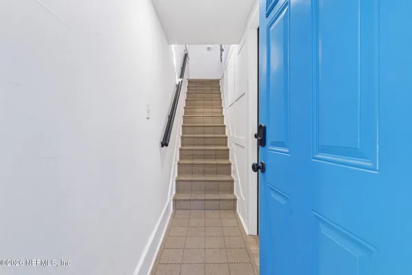 a view of a hallway with stairs