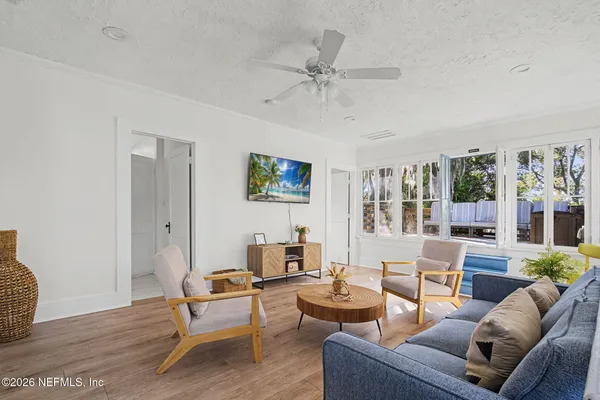 a living room with furniture and a large window
