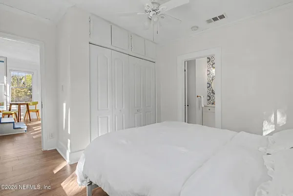 a large white bed in a white room