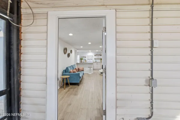a view of a hallway with seating area