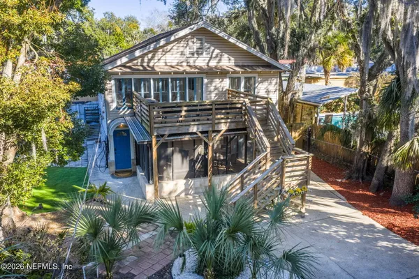 a view of a house with brick walls