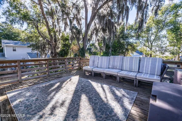 a view of a wooden bench in a backyard
