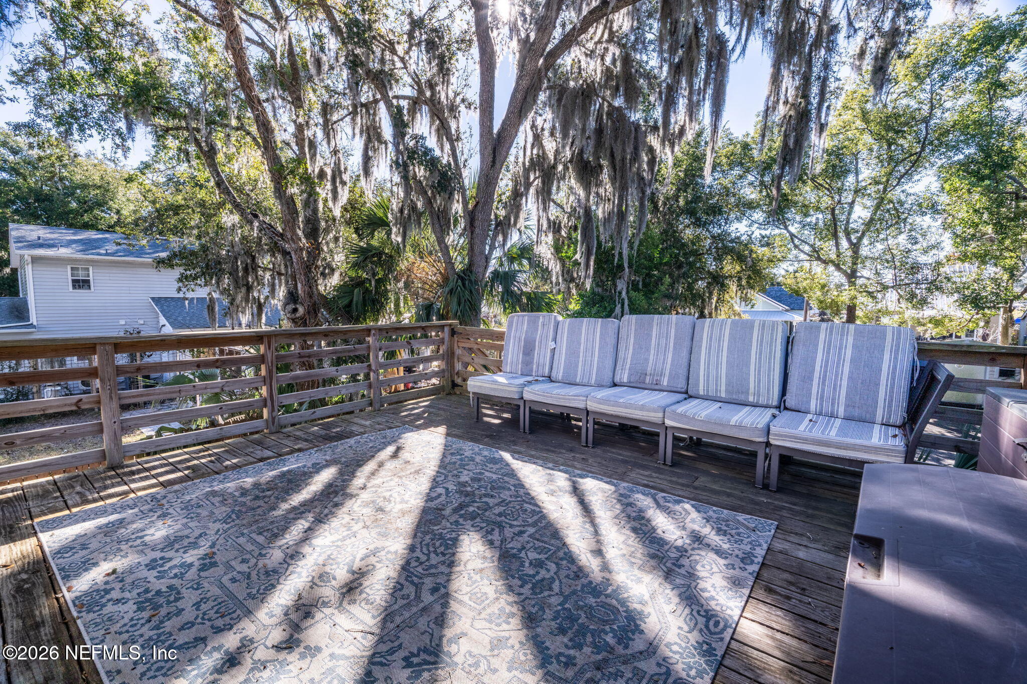 16 Myrtle Avenue St. Augustine, FL 32084 - Photo 35 of 47 a view of a wooden bench in a backyard