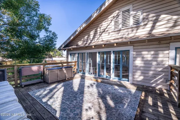 a view of a house with a backyard and a patio