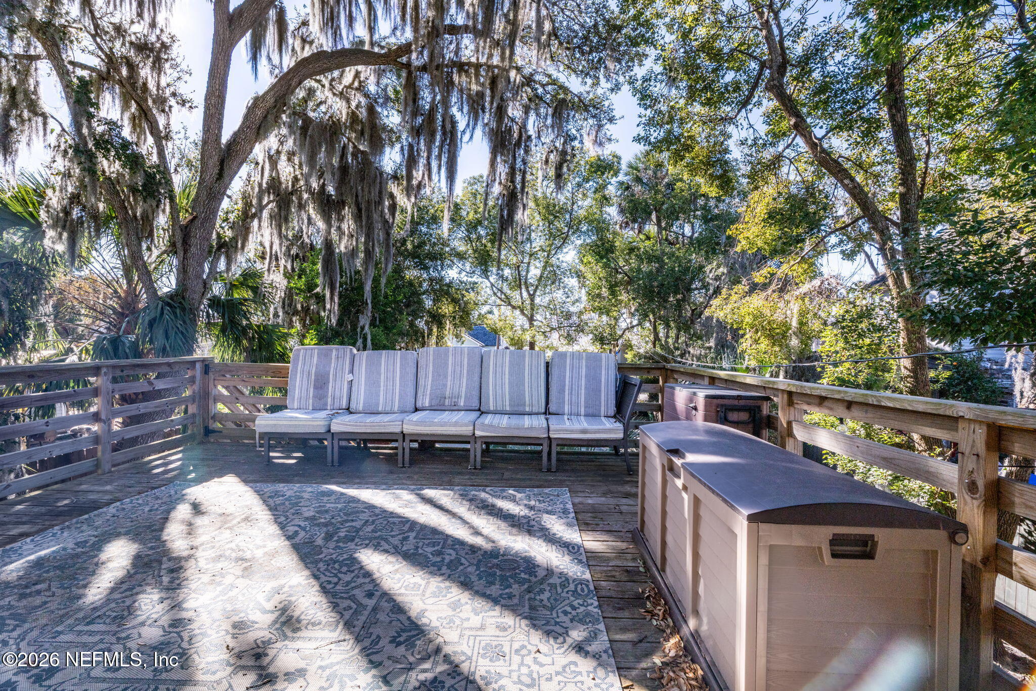16 Myrtle Avenue St. Augustine, FL 32084 - Photo 39 of 47 a backyard of a house with barbeque oven wooden fence and trees