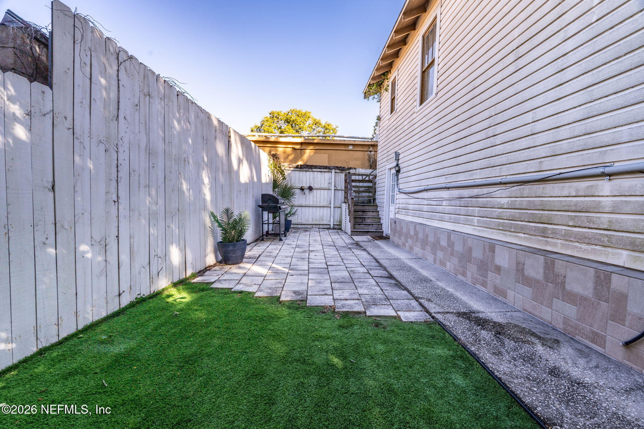 16 Myrtle Avenue St. Augustine, FL 32084 - Photo 40 of 47 a view of a backyard with wooden fence