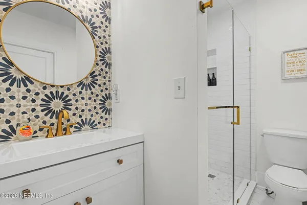 a bathroom with a toilet and a sink