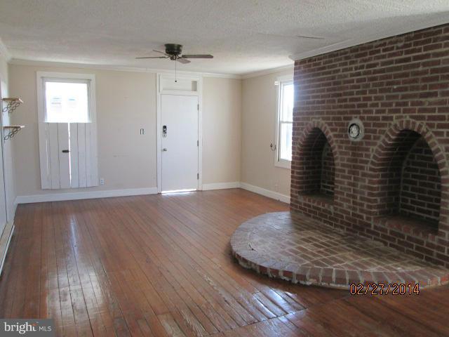 11003 Keymar Road Woodsboro, MD 21798 - Photo 14 of 15 a view of a livingroom with wooden floor