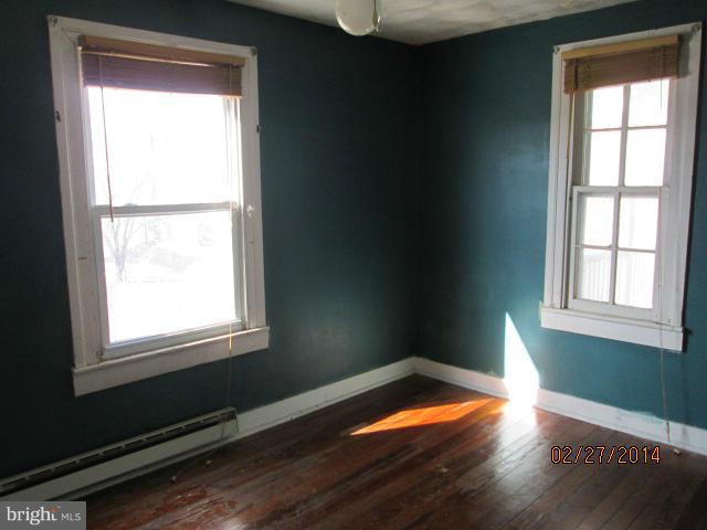 11003 Keymar Road Woodsboro, MD 21798 - Photo 7 of 15 a room with window and wooden floor