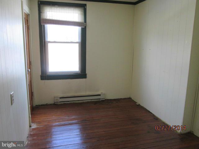 11003 Keymar Road Woodsboro, MD 21798 - Photo 9 of 15 an empty room with wooden floor and a window