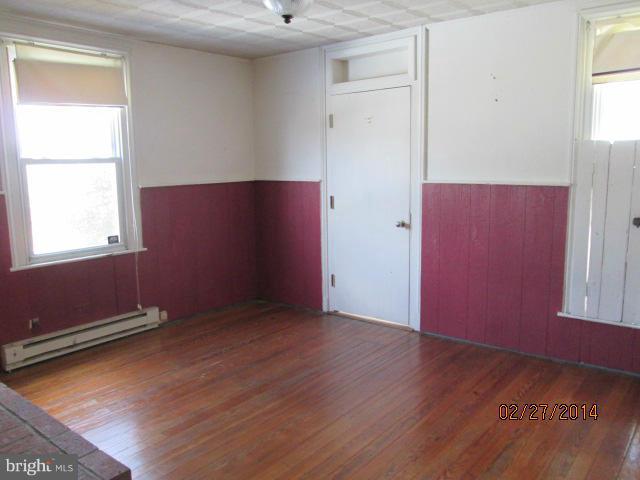 11003 Keymar Road Woodsboro, MD 21798 - Photo 10 of 15 an empty room with wooden floor and windows