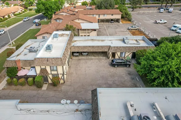 an aerial view of residential houses with outdoor space