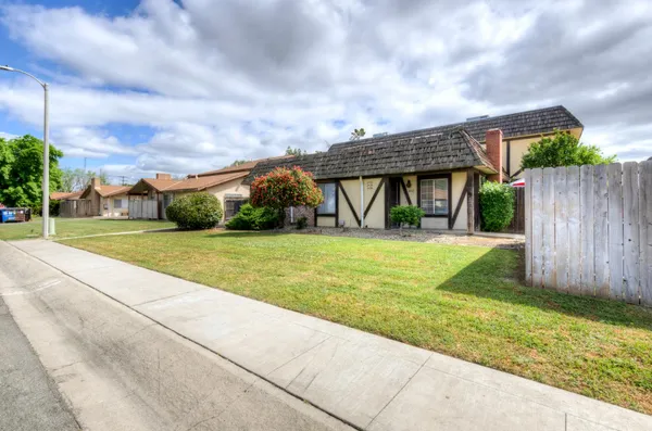 a view of house with yard