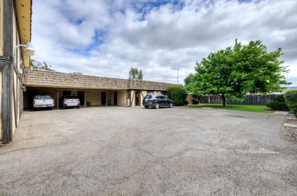 a view of house with a yard