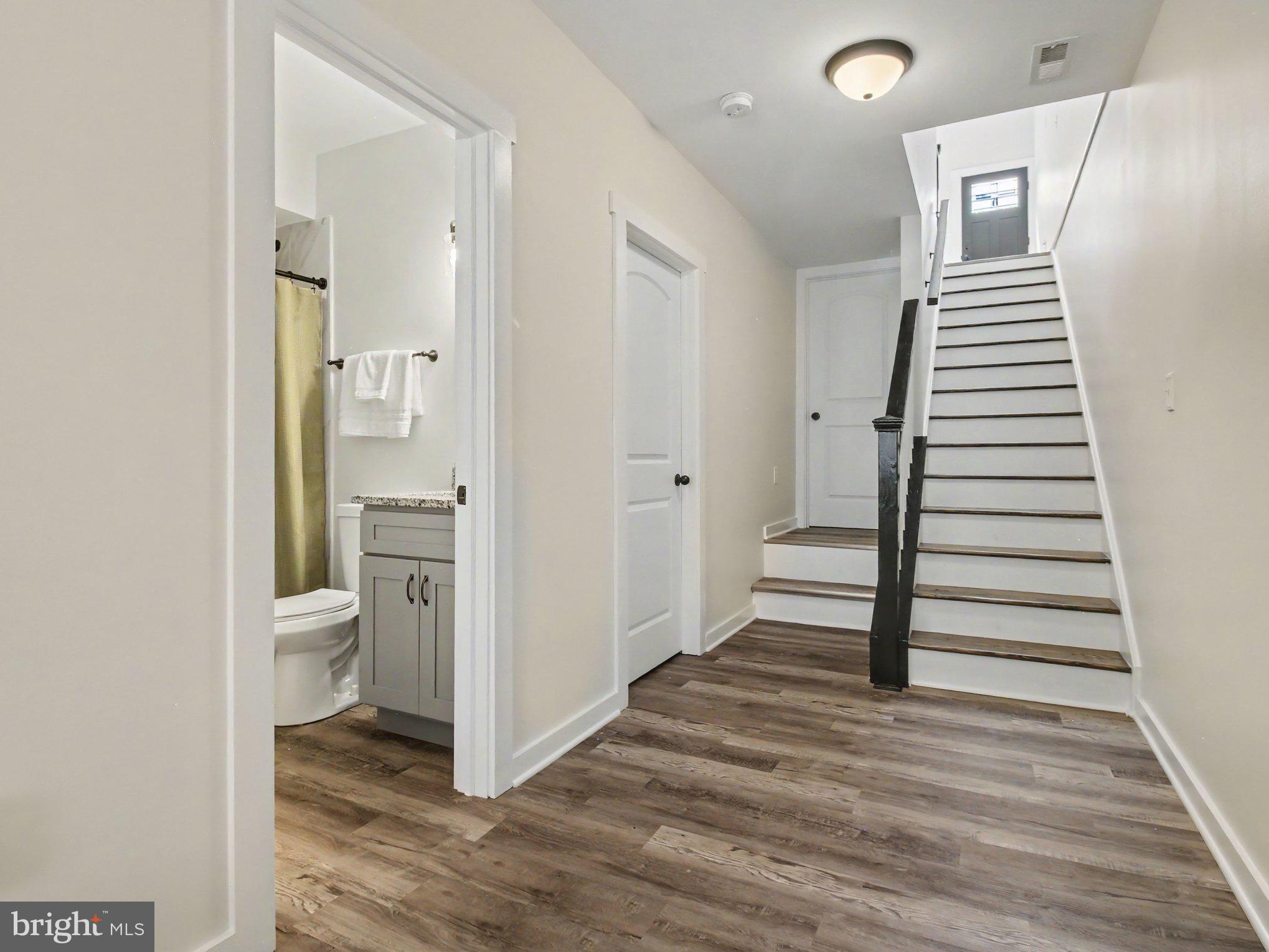3915 Roland Avenue Baltimore, MD 21211 - Photo 19 of 26 a view of a hallway with wooden floor and entryway