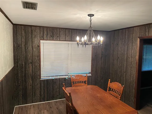 a balcony with table and chairs