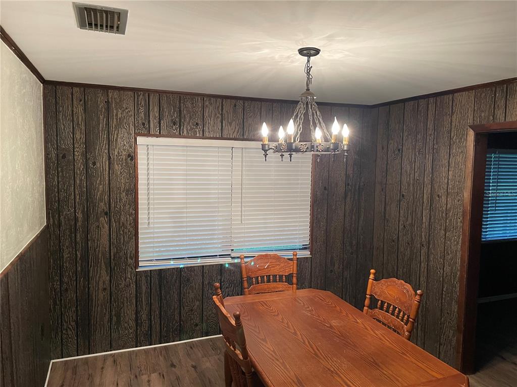 3267 Rackley Road Brooksville, FL 34604 - Photo 13 of 23 a balcony with table and chairs