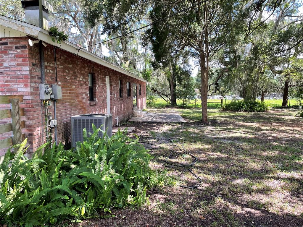 3267 Rackley Road Brooksville, FL 34604 - Photo 21 of 23 a backyard of a house with lots of green space