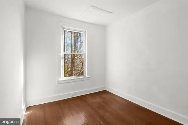 a bathroom with a sink and a window