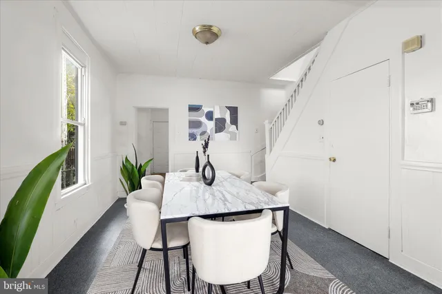 a view of an empty room with stairs