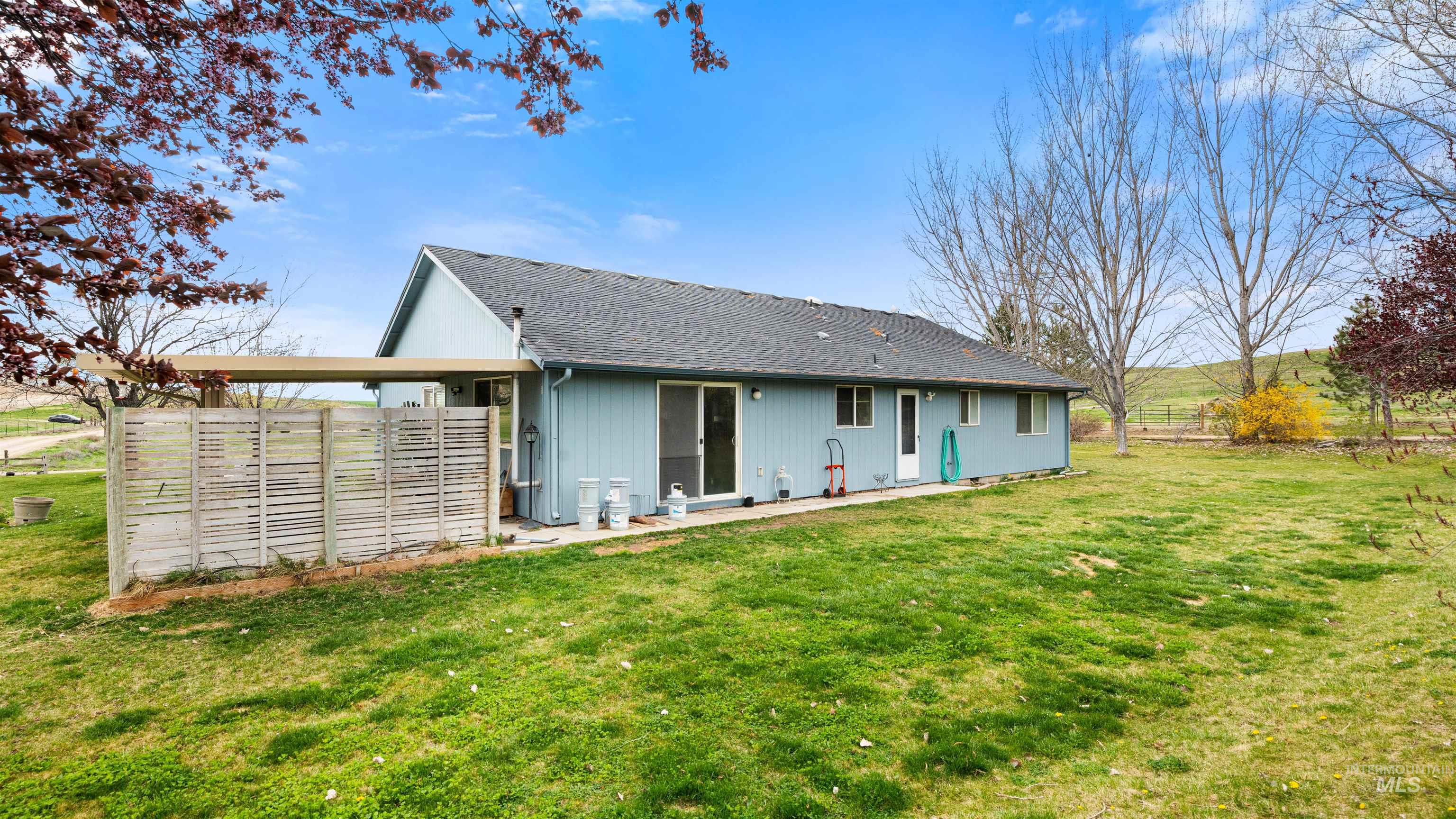 731 Tower Lane Caldwell, ID 83607 - Photo 15 of 38 Rear view of property with roof with shingles and a patio area