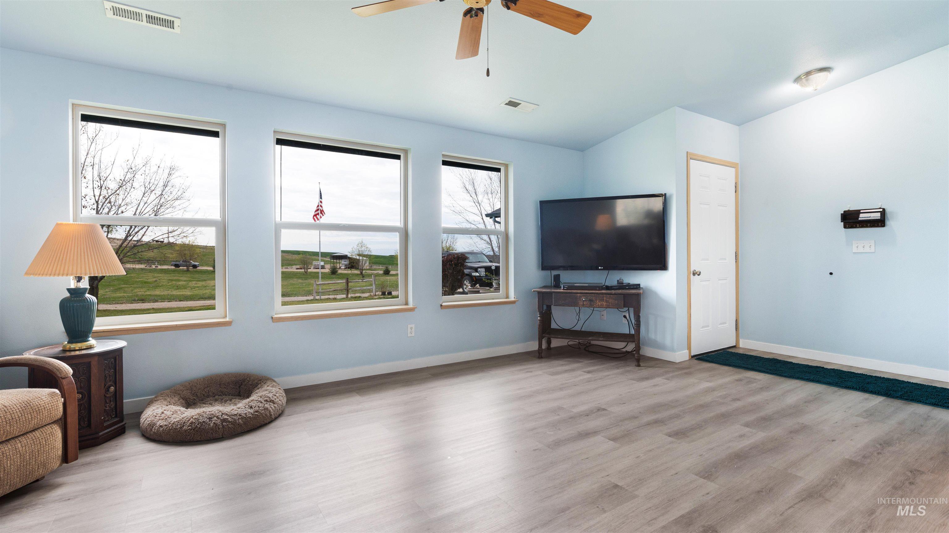 731 Tower Lane Caldwell, ID 83607 - Photo 17 of 38 Sitting room featuring a ceiling fan and light wood finished floors