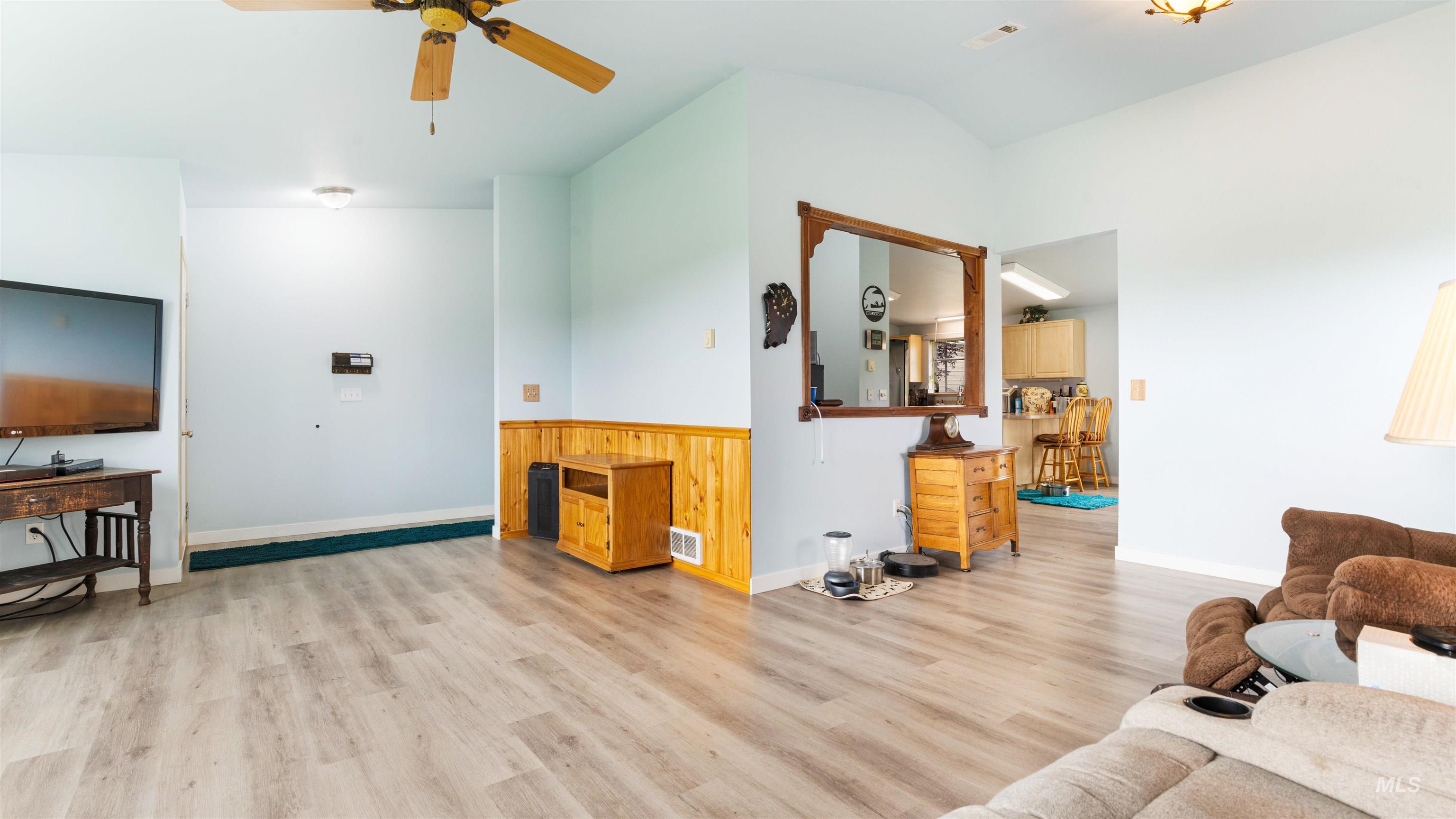 731 Tower Lane Caldwell, ID 83607 - Photo 18 of 38 Living area featuring light wood-type flooring, ceiling fan, and lofted ceiling