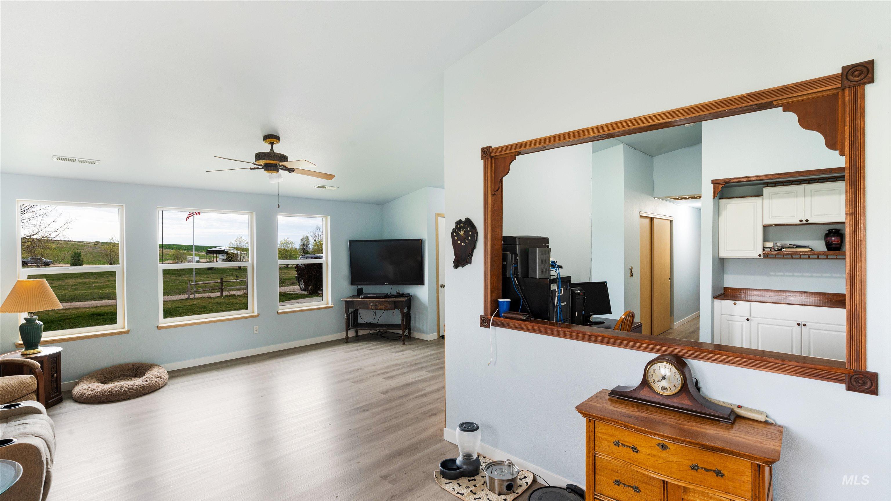 731 Tower Lane Caldwell, ID 83607 - Photo 20 of 38 Living room with wood finished floors and a ceiling fan