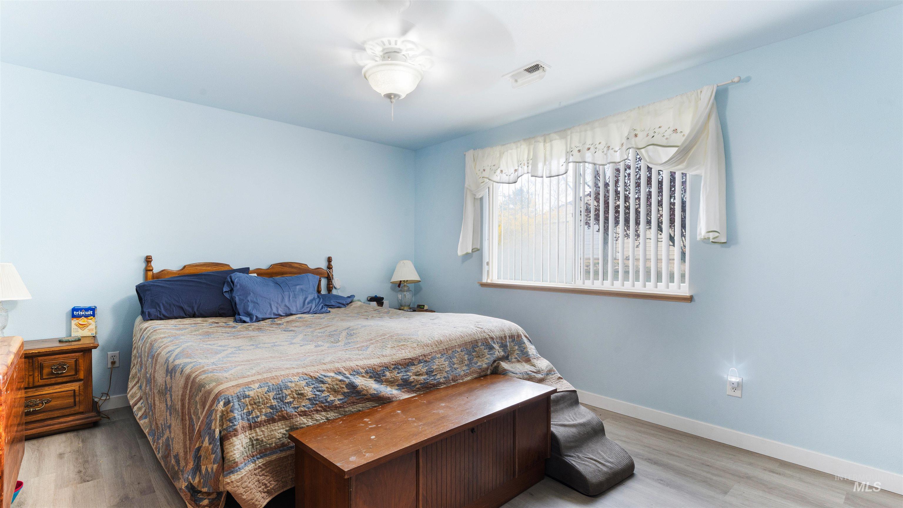 731 Tower Lane Caldwell, ID 83607 - Photo 31 of 38 Bedroom featuring light wood finished floors and ceiling fan