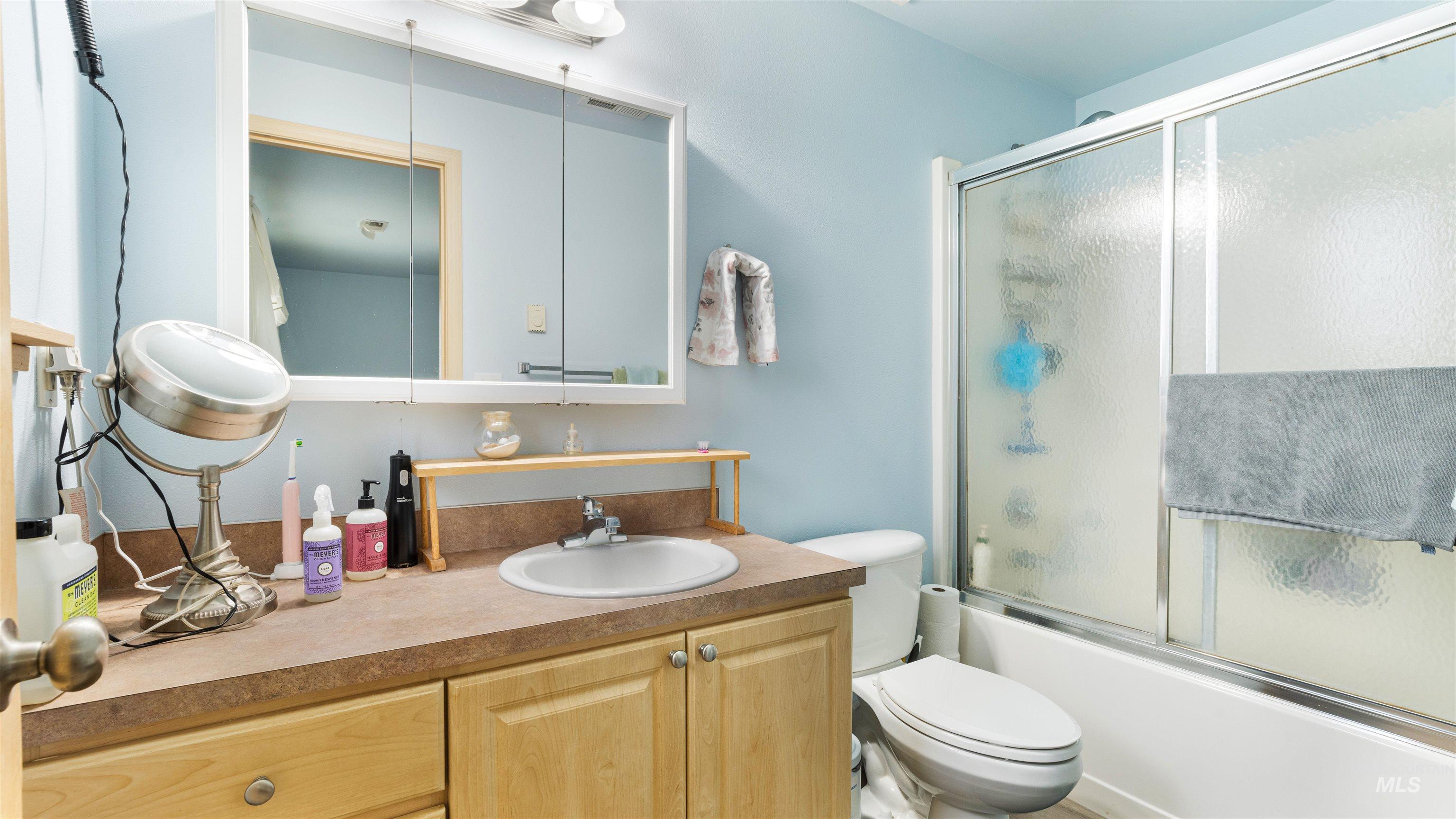 731 Tower Lane Caldwell, ID 83607 - Photo 34 of 38 Bathroom featuring vanity and combined bath / shower with glass door