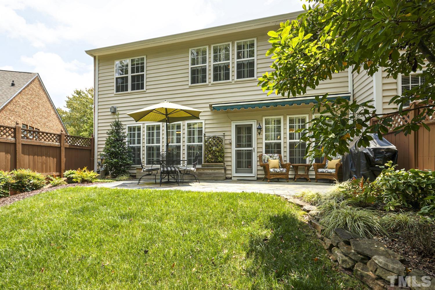 3917 Sunset Maple Court Raleigh, NC 27612 - Photo 14 of 54 front view of a house with a yard table and chairs