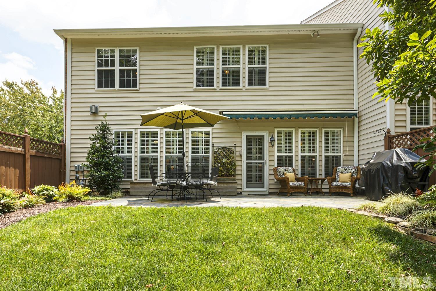 3917 Sunset Maple Court Raleigh, NC 27612 - Photo 15 of 54 a front view of a house with a patio