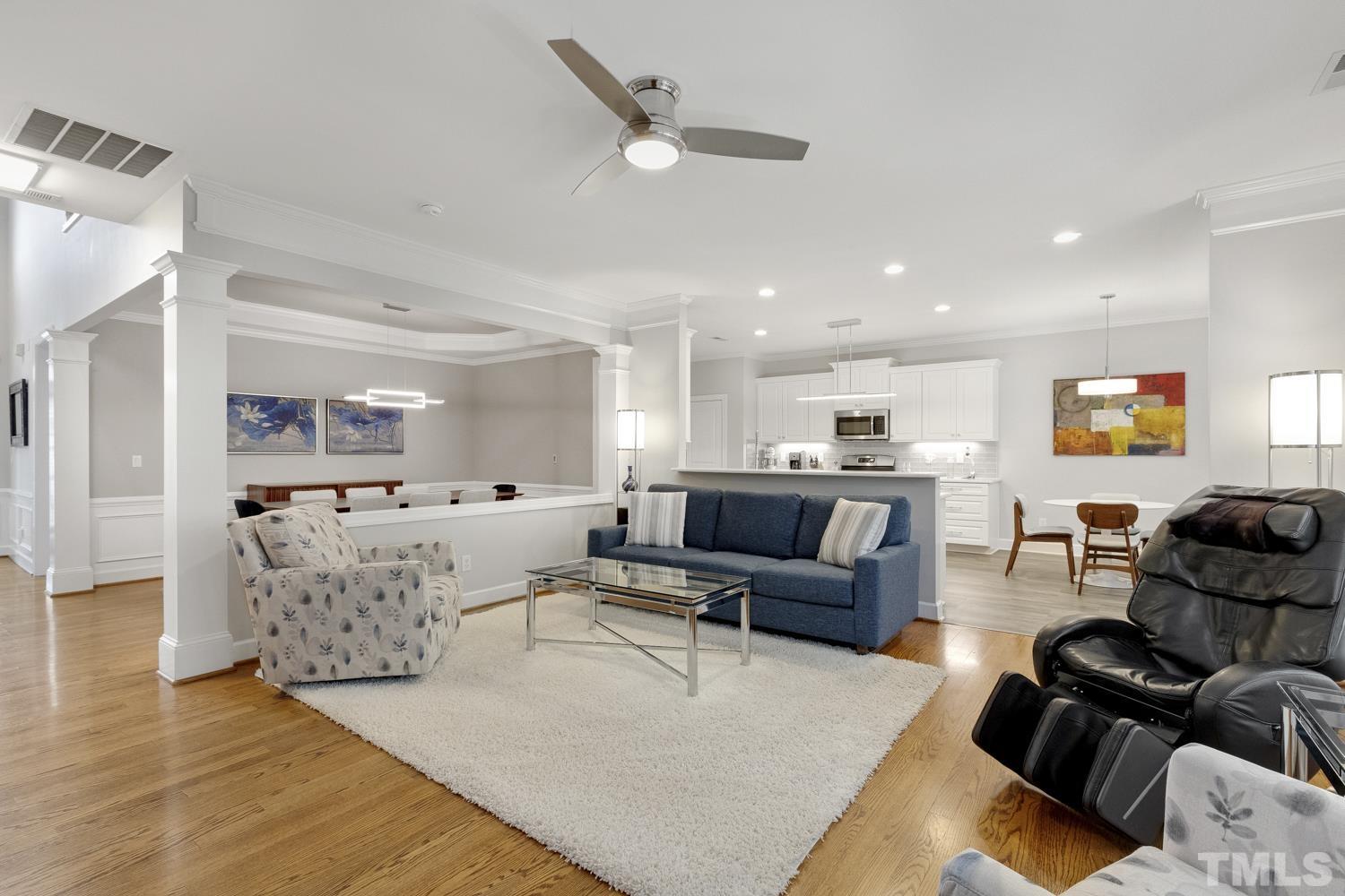 3917 Sunset Maple Court Raleigh, NC 27612 - Photo 24 of 54 a living room with furniture and a view of kitchen