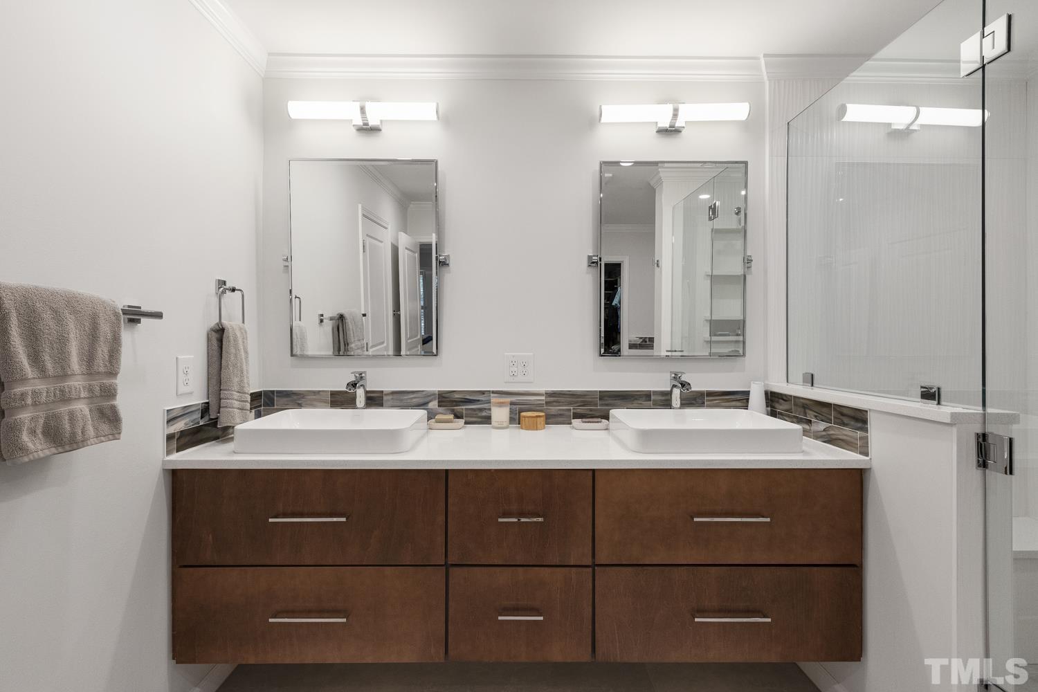3917 Sunset Maple Court Raleigh, NC 27612 - Photo 43 of 54 a bathroom with a double vanity sink and mirror