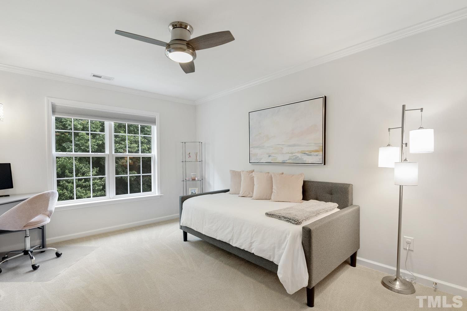 3917 Sunset Maple Court Raleigh, NC 27612 - Photo 47 of 54 a bed room with a bed and a chair
