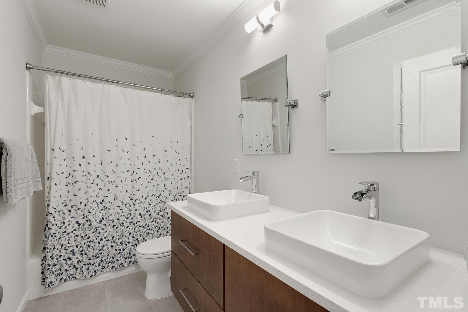 3917 Sunset Maple Court Raleigh, NC 27612 - Photo 49 of 54 a bathroom with a sink a toilet and shower