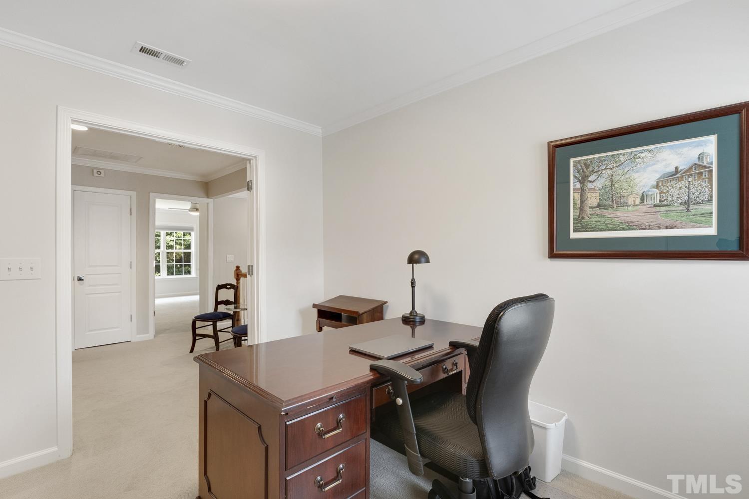 3917 Sunset Maple Court Raleigh, NC 27612 - Photo 53 of 54 a view of a workspace with furniture and a bathroom