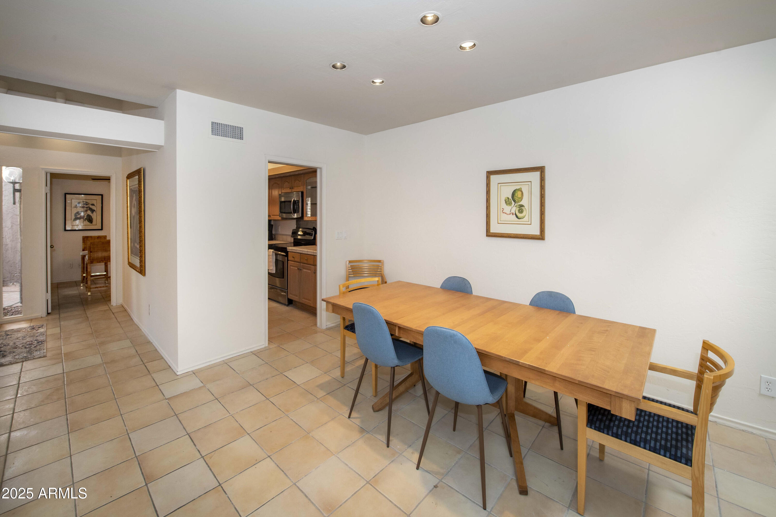 4446 East Camelback Road, Unit 109 Phoenix, AZ 85018 - Photo 11 of 42 a view of a dining room with furniture