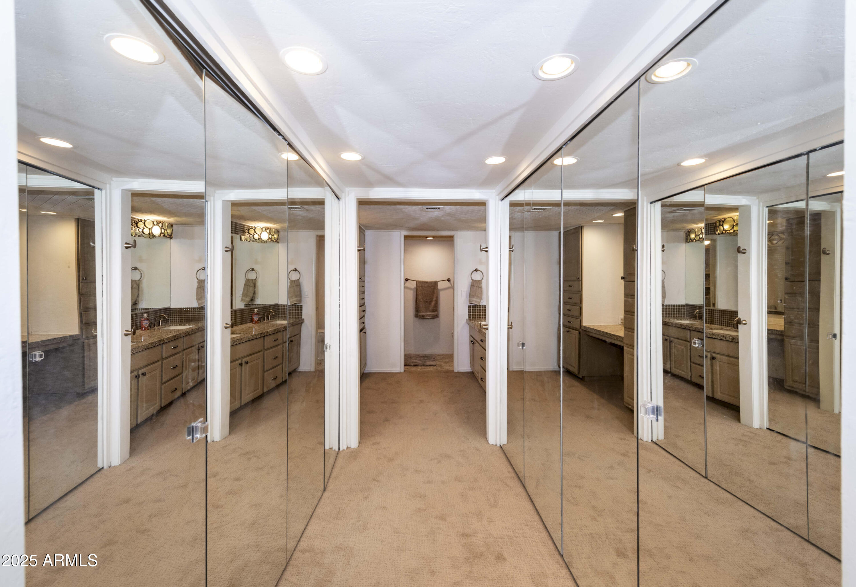 4446 East Camelback Road, Unit 109 Phoenix, AZ 85018 - Photo 21 of 42 a view of a hallway with closet and a couch