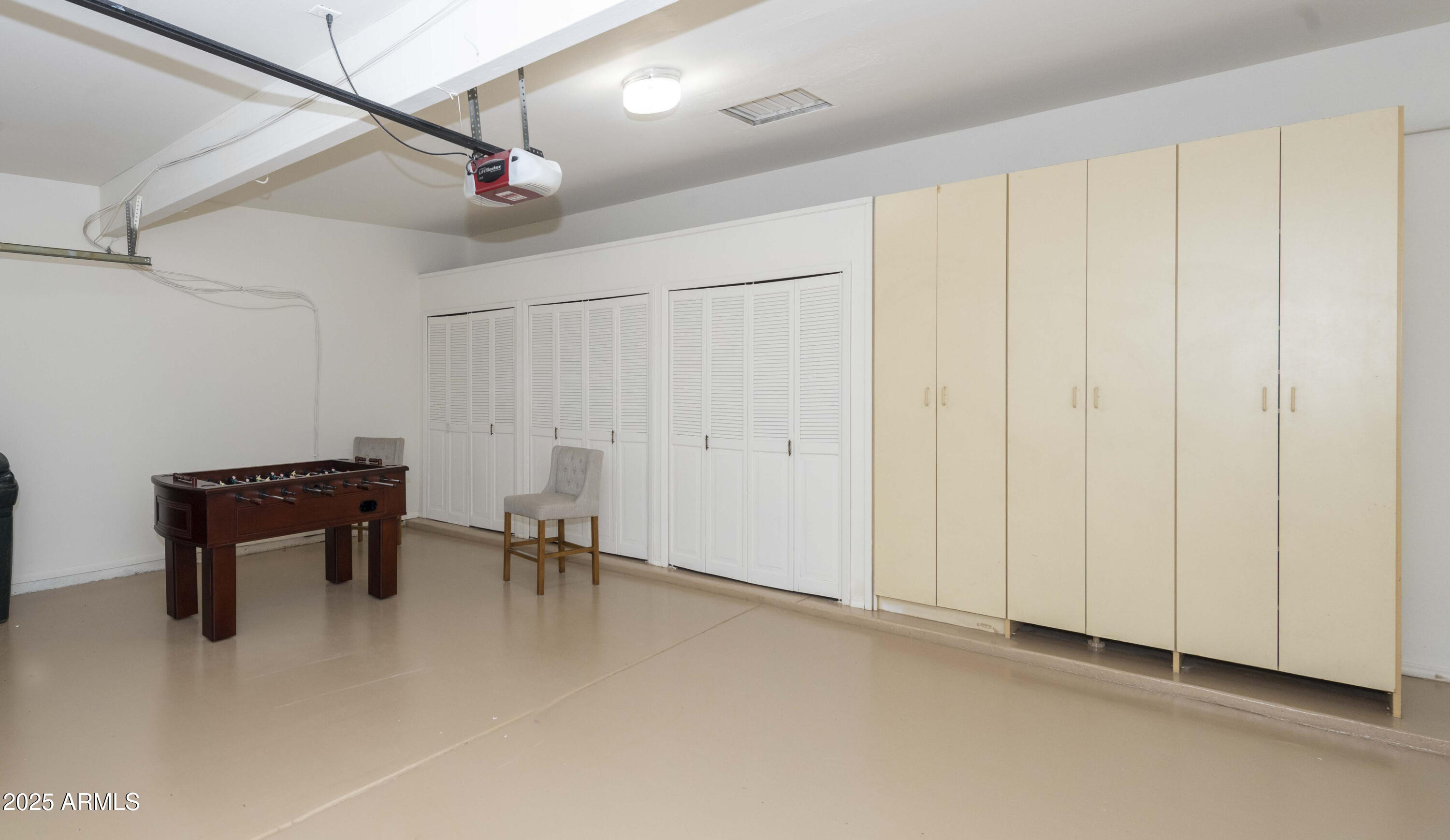 4446 East Camelback Road, Unit 109 Phoenix, AZ 85018 - Photo 31 of 42 a view of an empty room with a window