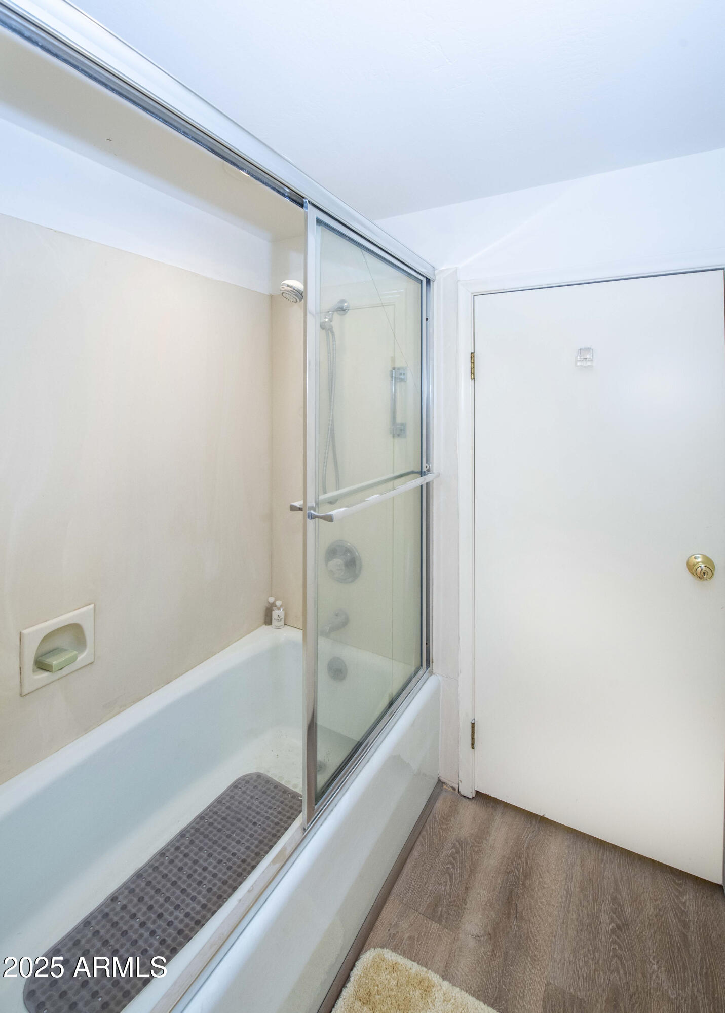 4446 East Camelback Road, Unit 109 Phoenix, AZ 85018 - Photo 33 of 42 a bathroom with a bathtub and a shower