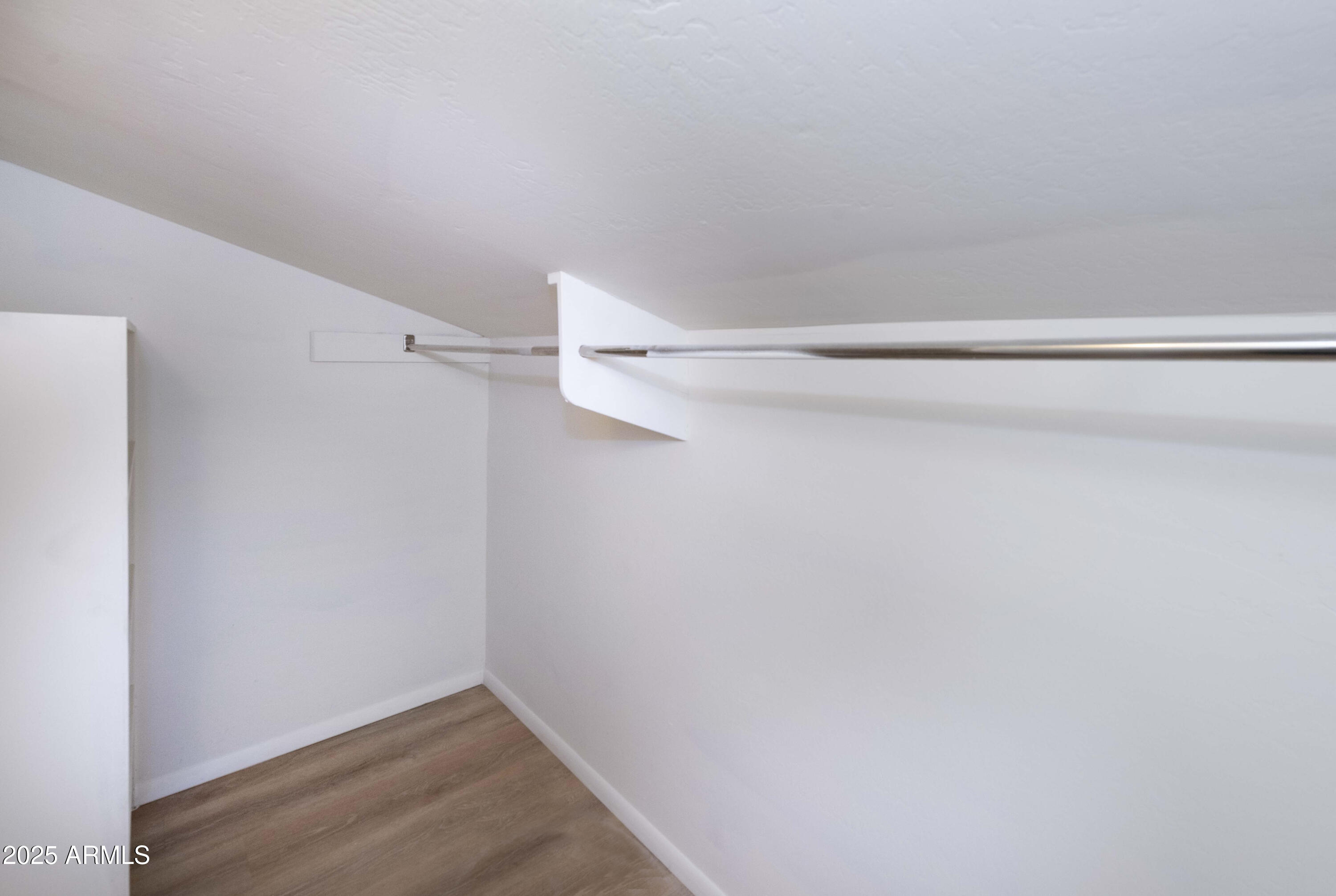 4446 East Camelback Road, Unit 109 Phoenix, AZ 85018 - Photo 34 of 42 a view of small space with racks on the wall