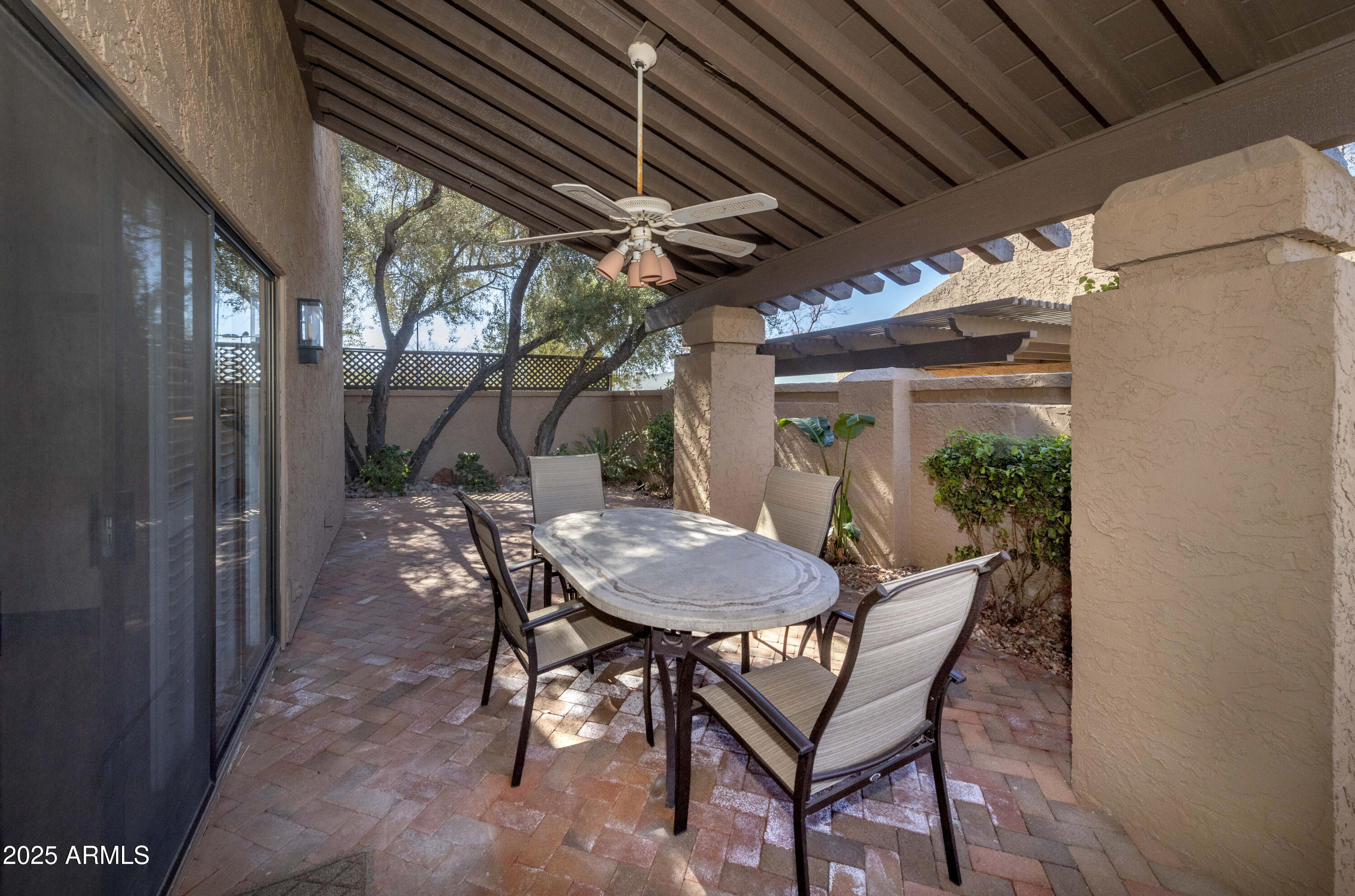 4446 East Camelback Road, Unit 109 Phoenix, AZ 85018 - Photo 38 of 42 a view of a outdoor space with table and chairs